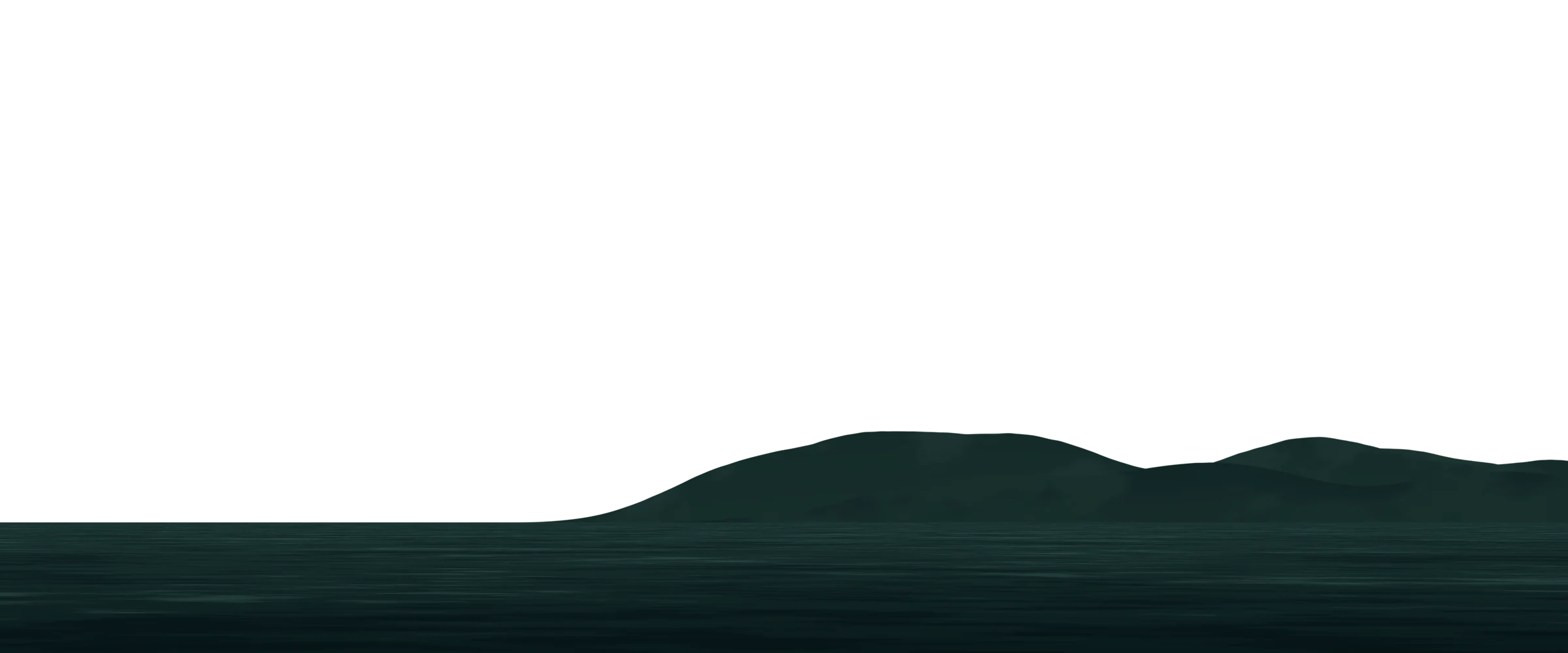 The moon rising behind mountains over calm water